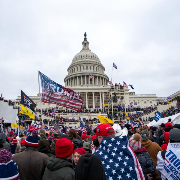 FILE - Insurrections loyal to President Donald Trump rally at the U.S. Capitol in Washington on Jan. 6, 2021. A Maryland police officer who fatally shot a stabbing suspect earlier this year was arrested Thursday, Oct. 19, 2023, on charges that he assaulted police during a mob's Jan. 6, 2021, attack on the U.S. Capitol. The Montgomery County Police Department said in a news release that it has suspended Officer Justin Lee without pay and is "taking steps to terminate his employment" after his indictment on felony charges. (AP Photo/Jose Luis Magana, File)