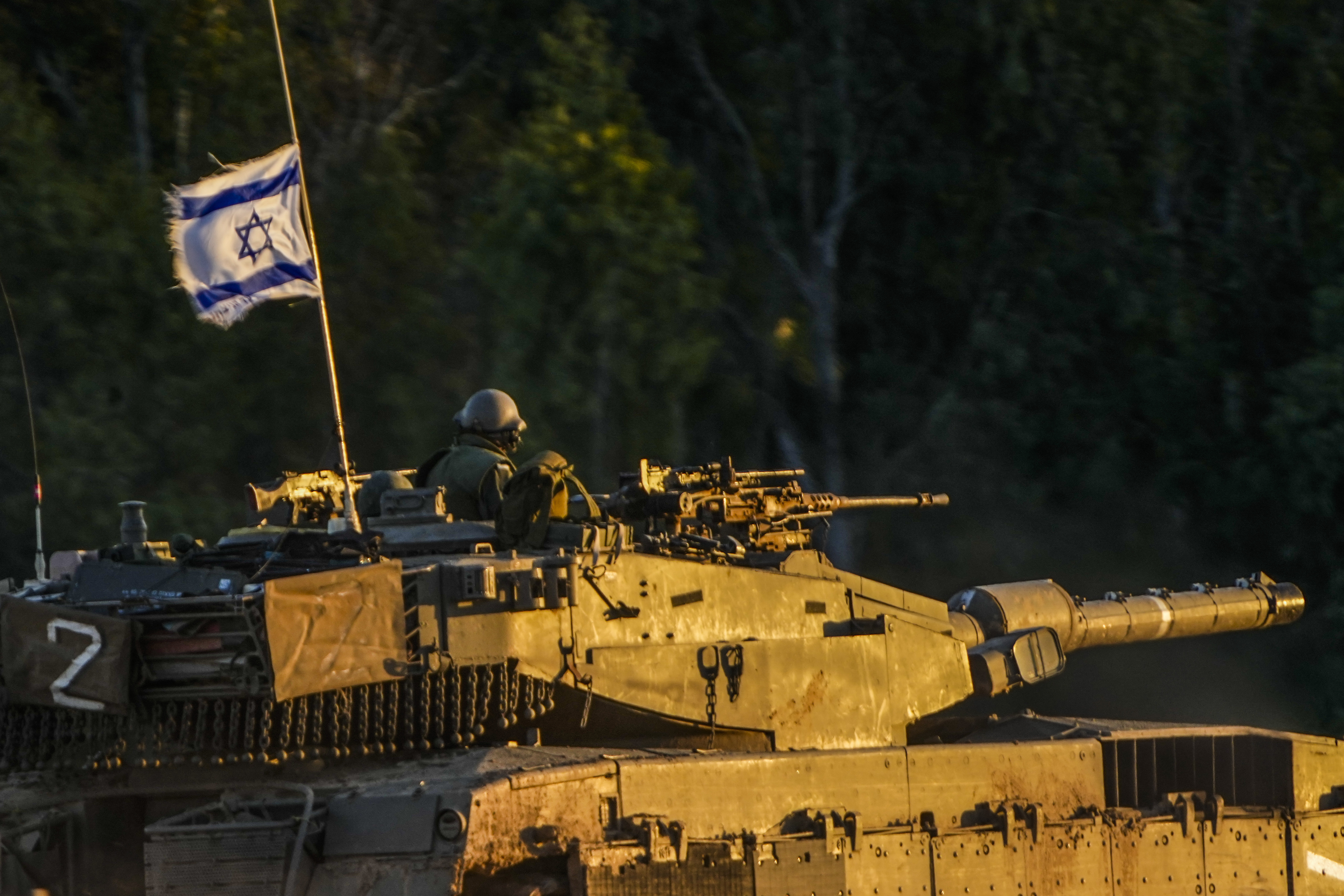 AN Israeli tanks moves along the Israel Gaza border as seen from southern Israel, Thursday, Jan. 4, 2024. (AP Photo/Ariel Schalit)