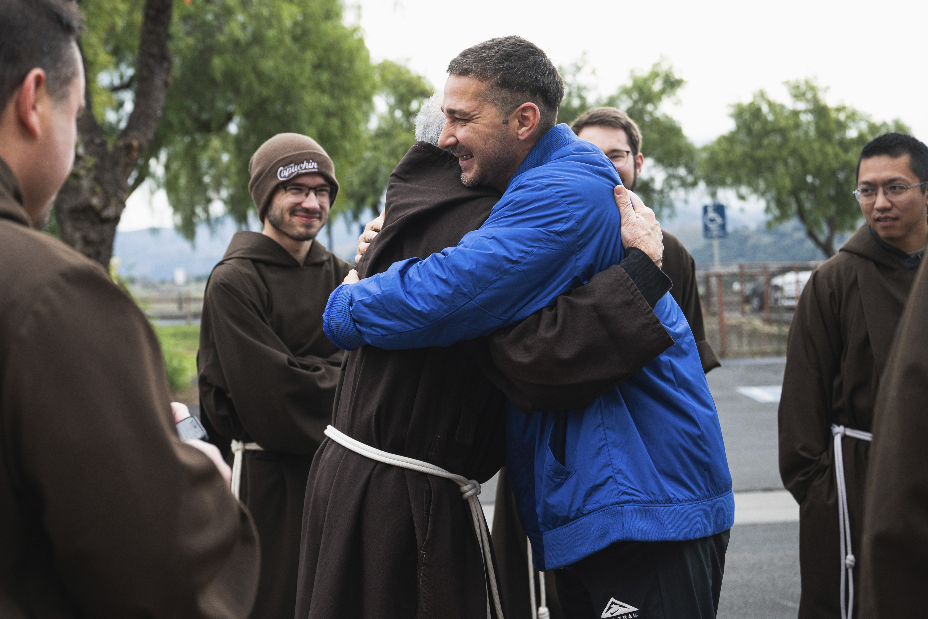 In this photo provided by Word on Fire Catholic Ministries, actor Shia LaBeouf celebrates his Catholic confirmation outside Old Mission Santa Inés Parish in Solvang, Calif., on Sunday, Dec. 31, 2023. “The Capuchin Franciscan friars are overjoyed to welcome him into the fold and witness his deep commitment to his faith journey,” the Catholic religious order said. (Word on Fire Catholic Ministries via AP)