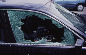 a black car with a broken glass window