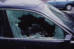 a black car with a broken glass window