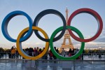 FILE - Olympic rings are set up at Trocadero plaza that overlooks the Eiffel Tower, a day after the official announcement that the 2024 Summer Olympic Games will be in the French capital, in Paris, France, Thursday, Sept. 14, 2017. The World Aquatics governing body published criteria Monday, Sept. 4, 2023, for Russian and Belarusian athletes, coaches and officials to return to try to qualify for the 2024 Paris Olympics as approved neutral athletes during their countries' war on Ukraine. (AP Photo/Michel Euler, File)